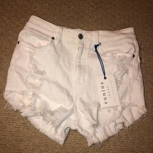 White ripped shorts never worn